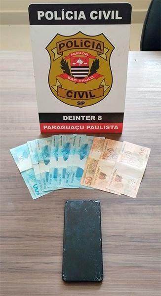 Reprodução/Polícia Civil - Durante o cumprimento dos mandados, foram localizados e apreendidos valores em espécie e o aparelho celular do investigado - Foto: Reprodução/Polícia Civil